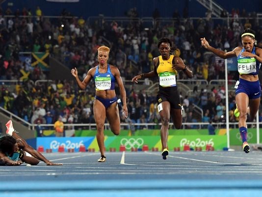 Shaunae Miller of Bahamas dives across the line to beat Allyson Felix in the 400