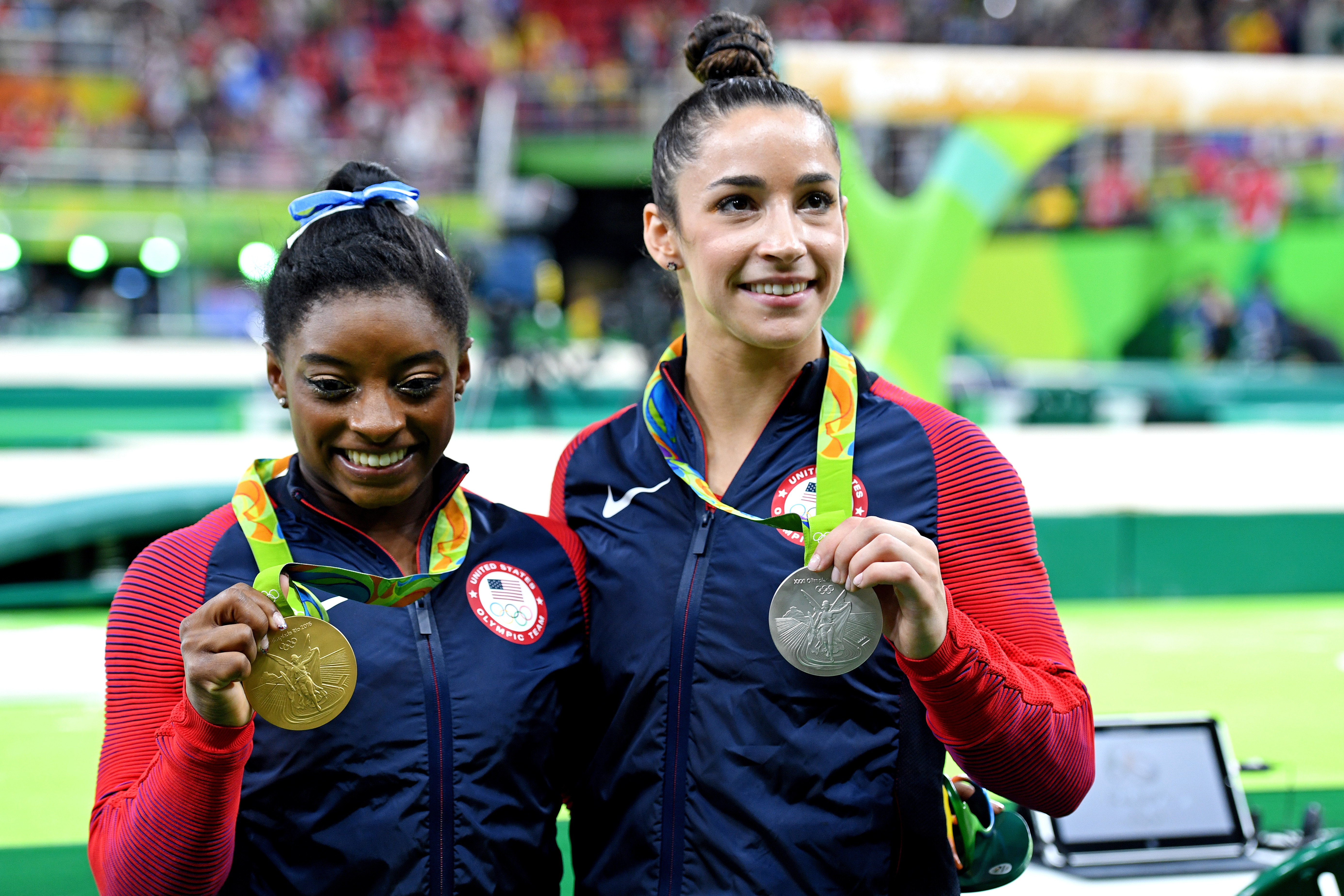 Aug 11 2016 Rio de Janeiro Brazil Simone Biles and Alexandra Raisman celebrate with their medals during the women's individual all-around final in the Rio 2016 Summer Olympic Games at Rio Olympic Arena. Mandatory Credit Robert Hanash