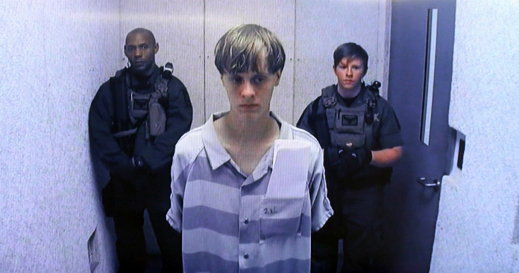 In this image from the video uplink from the detention center to the courtroom Dylann Roof appears at Centralized Bond Hearing Court