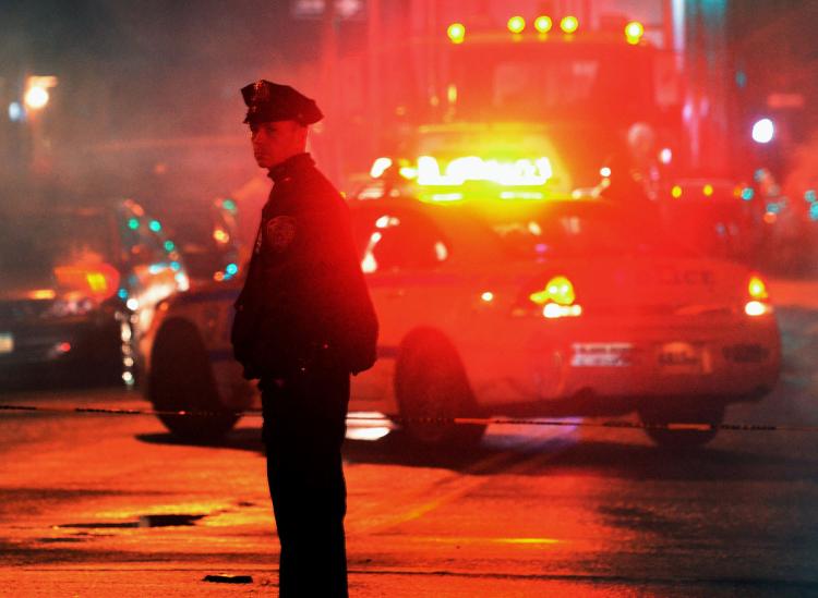 A file image shows a police officer at a crime scene. Austin Tex. police reported an 'active shooter incident&#39 downtown early Sunday