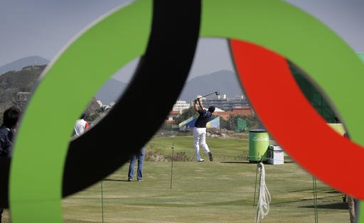 Brazil's Adilson Da Silva center hits off the first tee during golf practice at the 2016 Summer Olympics in Rio de Janeiro Brazil Friday Aug. 5 2016