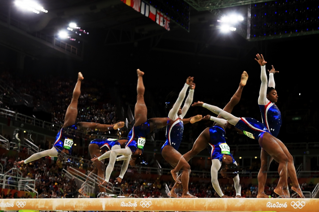 Simone BIles competes on the balance