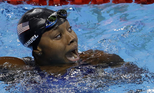 United States&#039 Simone Manuel celebrates winning the gold medal and setting a new olympic record in the women's 100-meter freestyle during the swimming competitions at the 2016 Summer Olympics Thursday Aug. 11 2016 in Rio de Janeiro Brazil