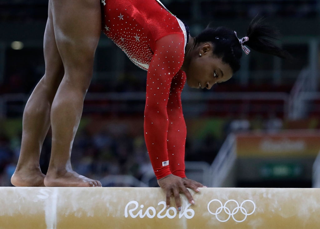 Simone Biles stumbles on her balance beam routine during the artistic gymnastics women's apparatus final