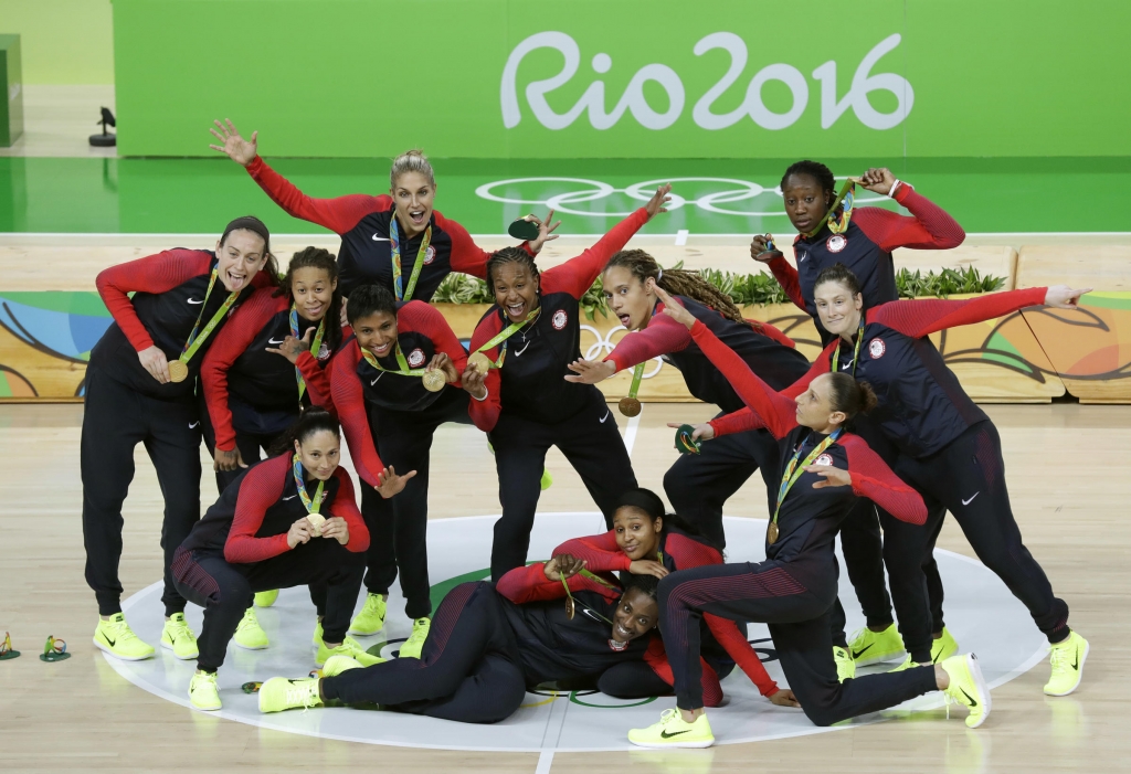 The U.S. women's basketball team poses Saturday after winning their sixth straight gold medal and their 49th straight game in the Olympics. Their success reflects the growing dominance of U.S. women in recent Olympiads. The U.S. women have won more