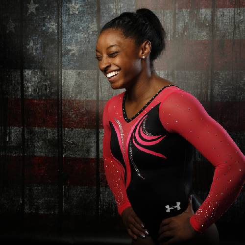 Biles laughs as she poses for a portrait at the U.S. Olympic Committee Media Summit in Beverly Hills Los Angeles Calif