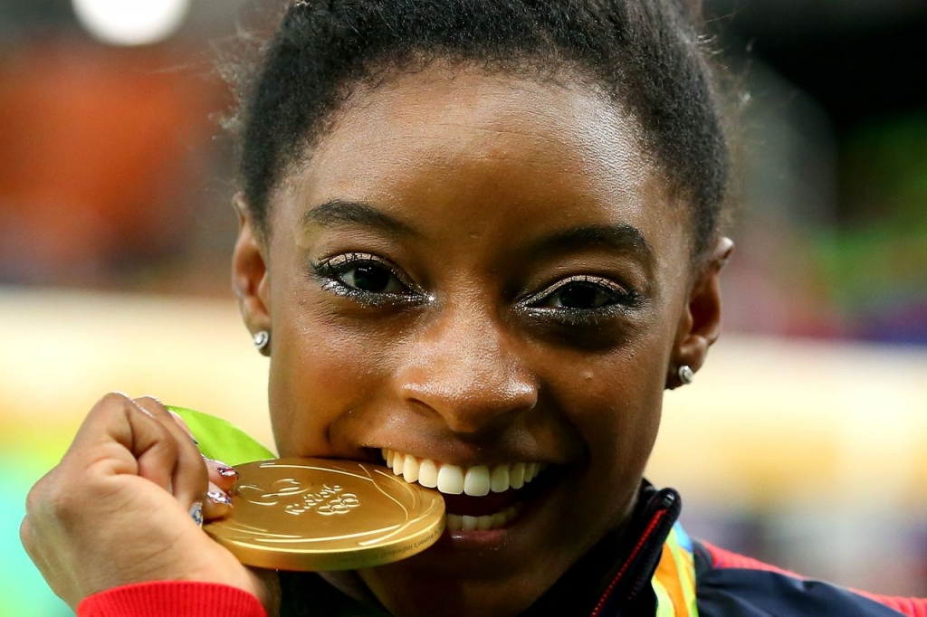 Simone Biles reaches new heights with all-around Olympic gold medal