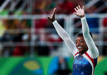 Simone Biles won gold with an overwhelming lead in the women's all-around on Thursday