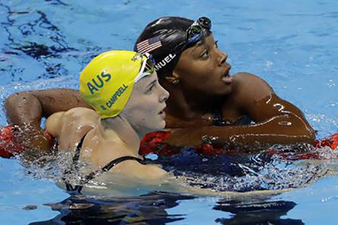 United States Simone Manuel right looks at the scoreboard with Australia's Bronte Campbell and wins the gold medal setting a new olympic record in the women's 100-meter freestyle during the swimming competitions at the 2016 Summer Olympics Thursday A