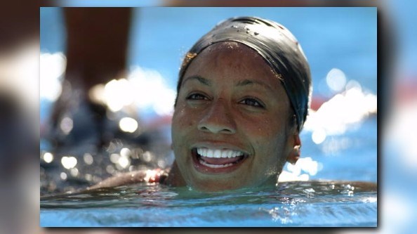 Manuel becomes first African American woman to win swim gold