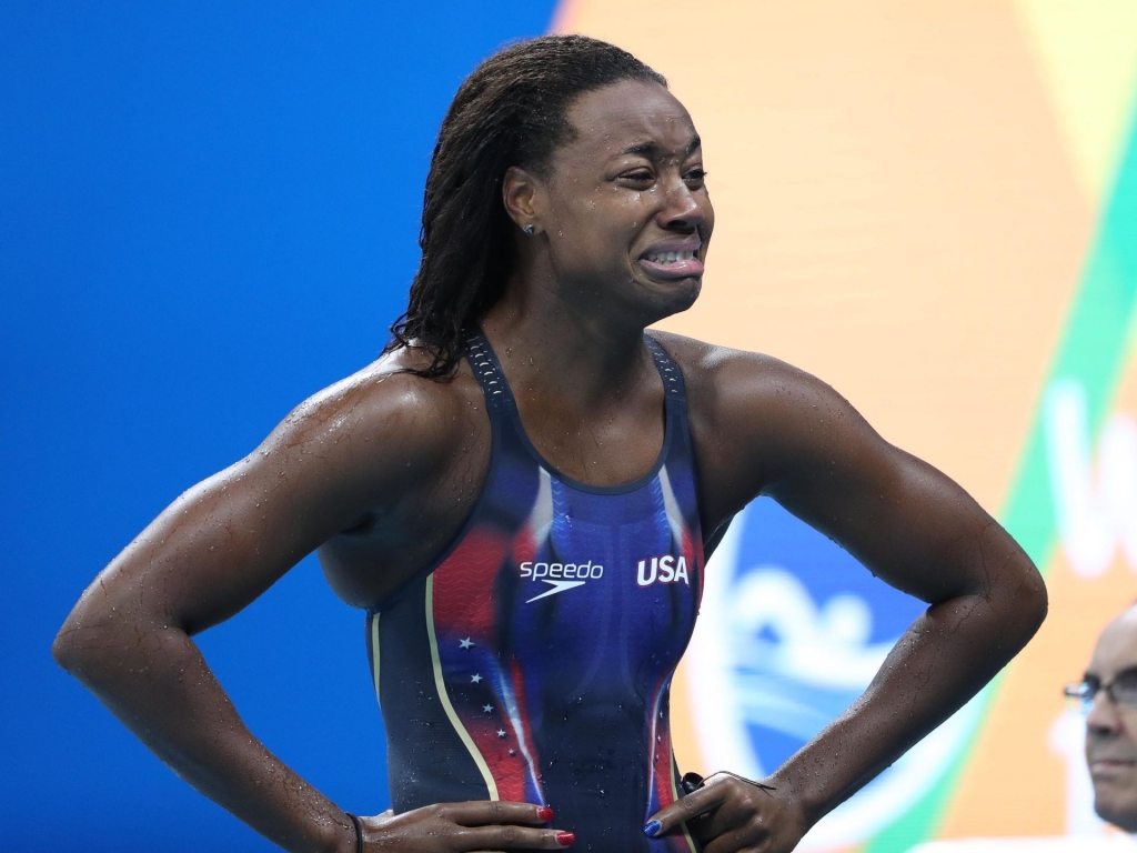 Simone Manuel reacts after getting gold in the women's 100-meter freestyle final. Erich Schlegel USA TODAY Sports