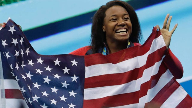 Aug 12 2016 Simone Manuel celebrates winning the gold medal in the women's 100-meter freestyle during the swimming competitions at the 2016 Summer Olympics