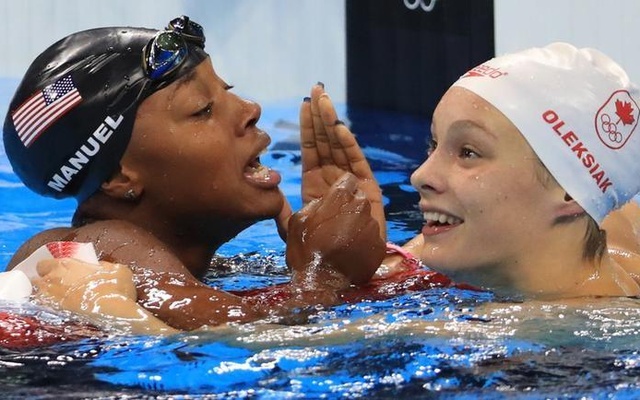 Simone Manuel and Penelope Oleksiak celebrate winning joint gold medals and also jointly breaking an Olympic record. Reuters