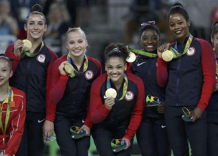 2016 Rio Olympics- Artistic Gymnastics- Victory Ceremony- Women's Team Victory Ceremony- Rio Olympic Arena- Rio de Janeiro Brazil- 09/08/2016. The U.S. team poses with their medals after winning the gold at the women's team final. REUTERS  Damir Sag