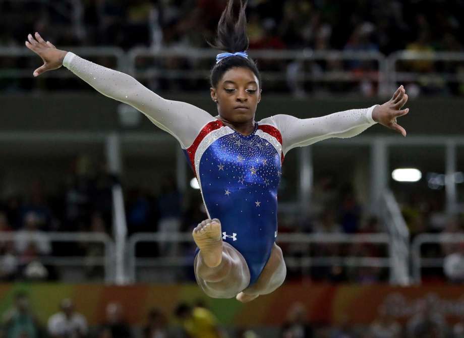 United States Simone Biles performs on the balance beam during the artistic gymnastics women's individual all-around final at the 2016 Summer Olympics in Rio de Janeiro Brazil Thursday Aug. 11 2016. ORG XMIT OGYM230