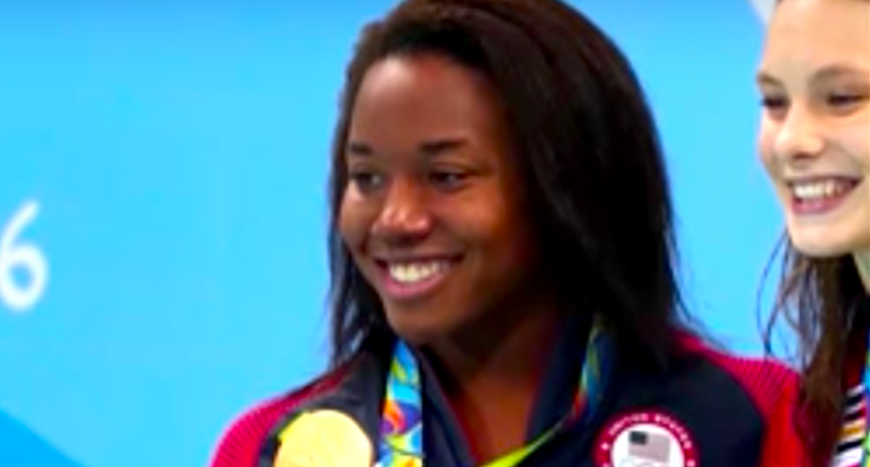 Image Olympic gold medalist swimmer Simone Manuel receives her gold medal in historic win