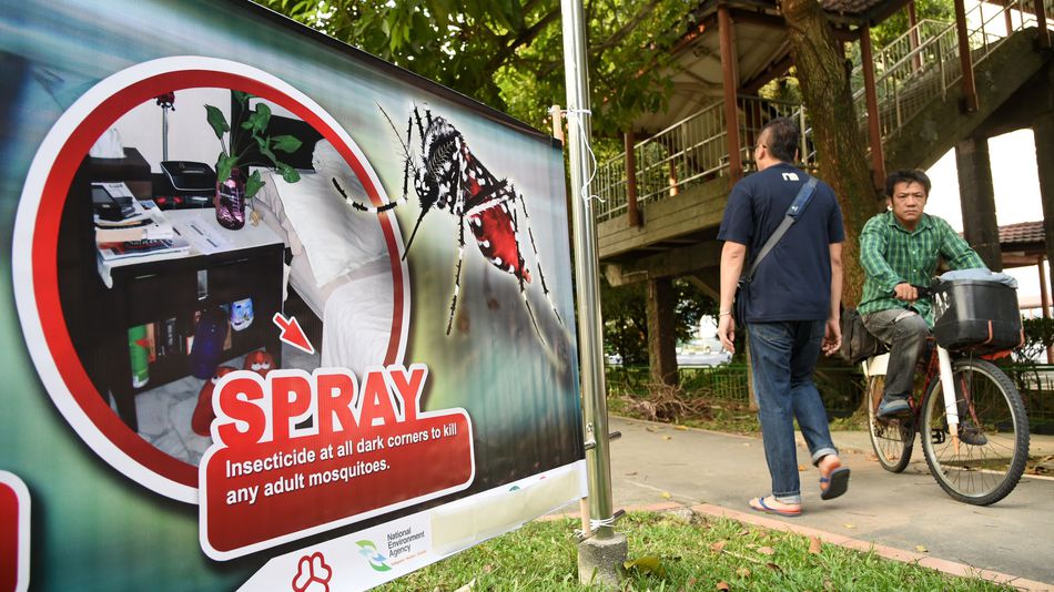 A public service banner against the spread of Aedes mosquitoes a carrier for the Zika virus at a residential block at Aljunied Crescent neighbourhood in Singapore