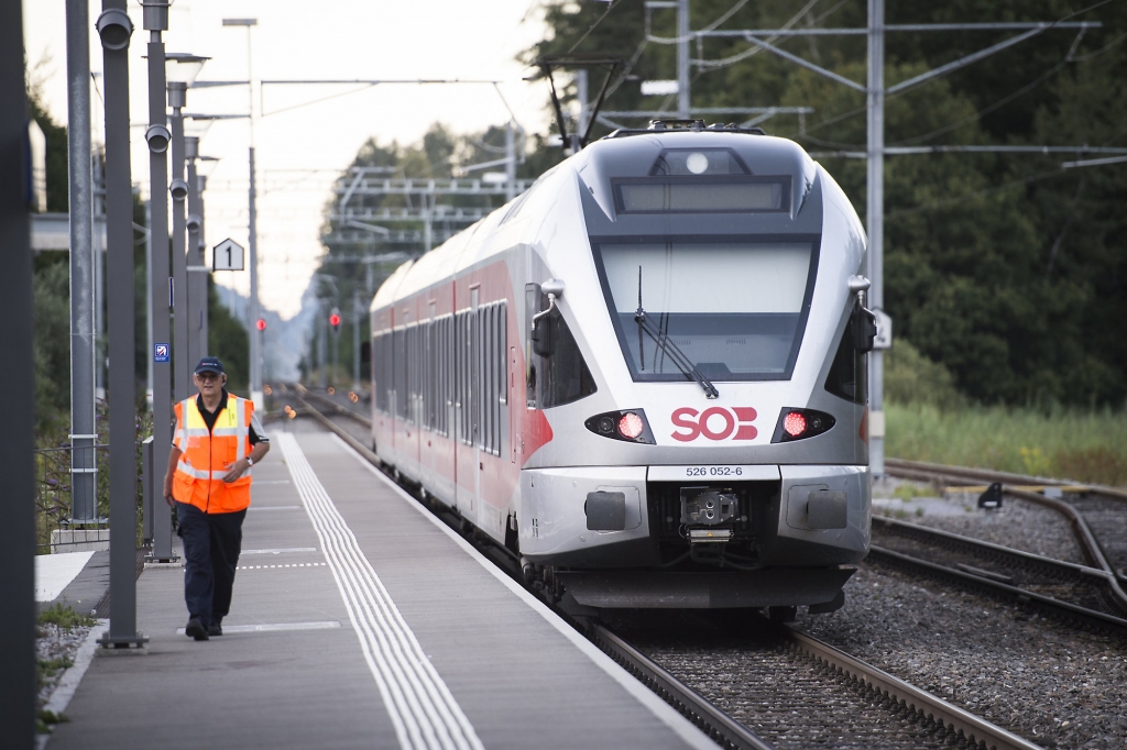 The train stands at the station after a man attacked other passengers aboard the train at Salez Switzerland on Saturday Aug. 13 2016. Police in Switzerland say a Swiss man set a fire and stabbed people on a train in the country's northeast wound