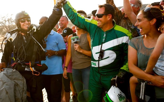 Skydiver Luke Aikins celebrates after landing safely