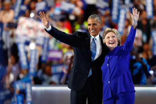 President Barack Obama and Democratic presidential candidate Hillary Clinton wave to the crowd at the Democratic National Convention