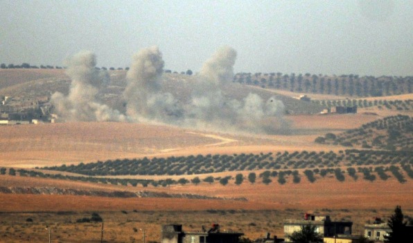 Smoke billows up on Syrian side of border after Turkish troops and warplanes entered into the battle against