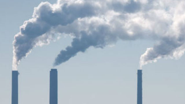 Smokestacks emitting greenhouse gases