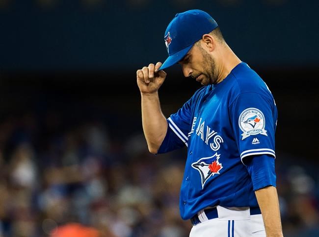 Toronto Blue Jays starting pitcher Marco Estrada looks down as he works against the Tampa Bay Rays during fifth inning AL baseball action in Toronto on Tuesday