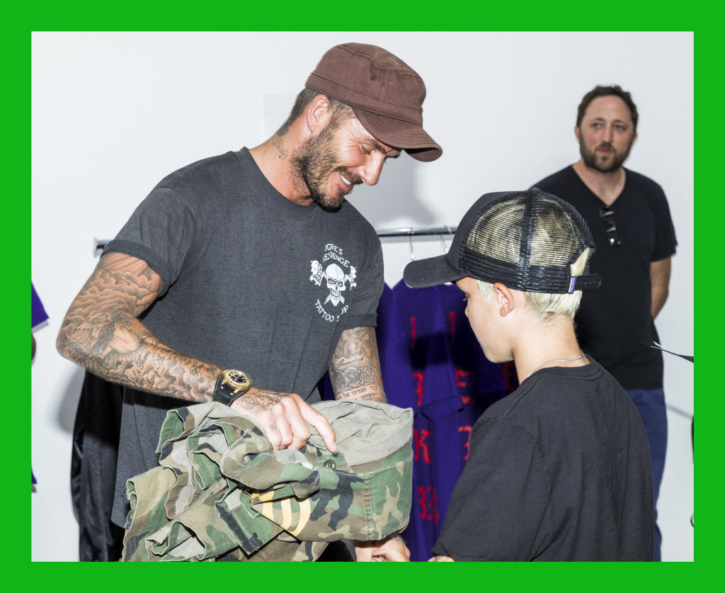 Soccer icon David Beckham and his son Cruz David Beckham at the Kanye West temporary Pablo store in Los Angeles. | Getty Images