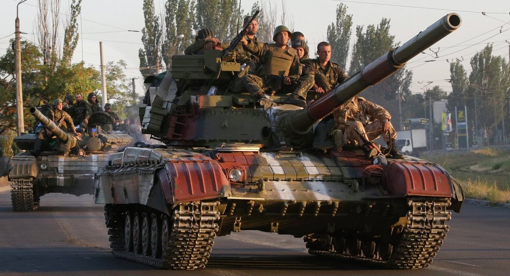 Soldiers from the Ukrainian army ride on tanks in the port city of Mariupol southeastern Ukraine Friday Sept. 5 2014