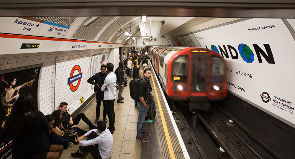 A London Underground train arrives at Oxford Circus station in central London