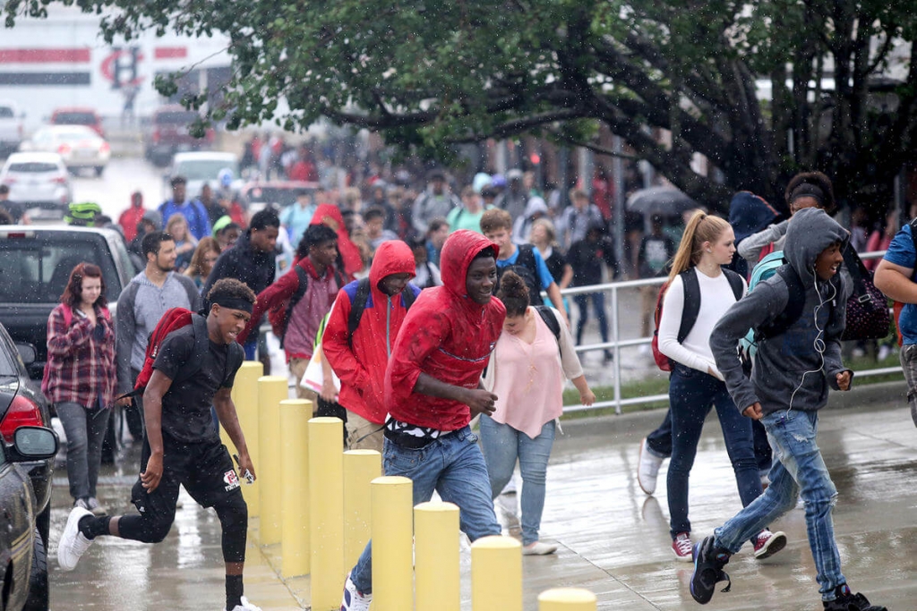 Heavy rain, street flooding causes rescues, school closings