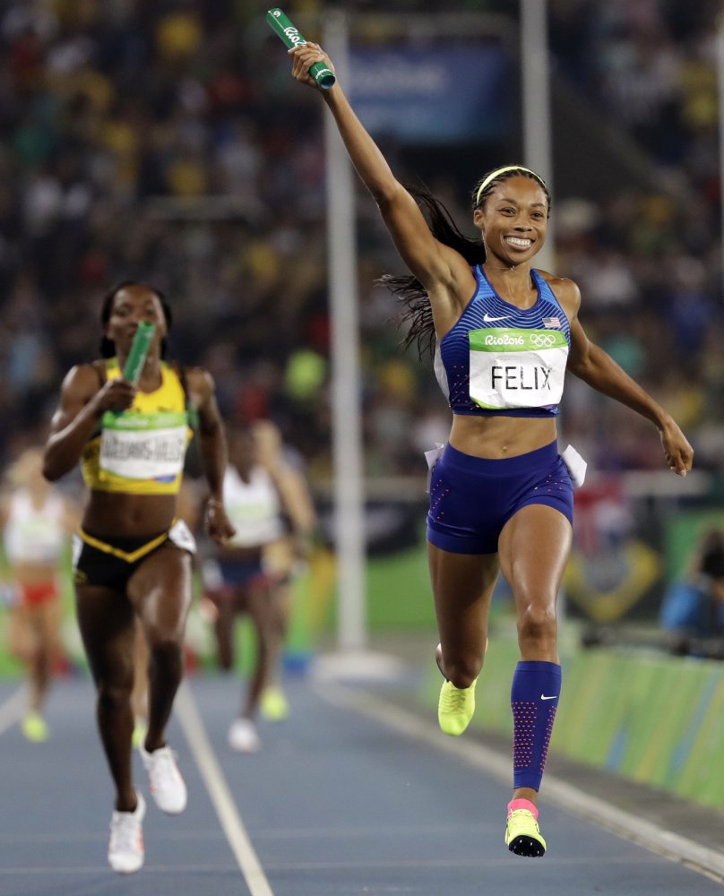 Allyson Felix of the U.S. celebrates as she crosses the finish line of the 1,600-meter relay earning a record sixth career gold medal