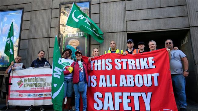 Southern Railways employees with the Rail Maritime and Transport union pose for camera during a five-day strike