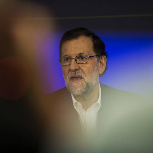 Prime Minister and Popular Party leader Mariano Rajoy poses for the media prior a meeting at the party headquarters in Madrid Wednesday Aug. 17 2016. Rajoy is meeting with party members to decide if it accepts conditions