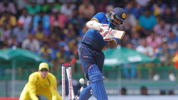 Sri Lanka's Kusal Perera is bowled out off a delivery by Australia's Mitchell Starc during their first one day international cricket match in Colombo Sri Lanka Sunday Aug. 21 2016. | AP