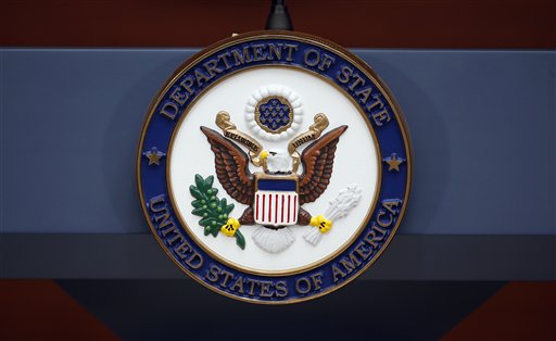 The seal of the State Department is seen before Secretary of State John Kerry speaks at the Washington Passport Agency Tuesday