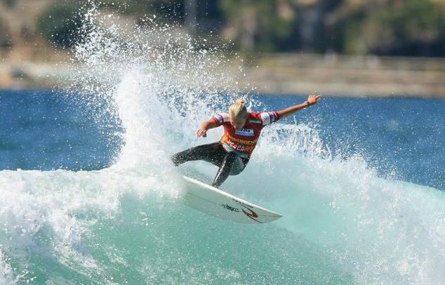 Stephanie Gilmore of Australia rides a wave during the Havaianas Beachley Classic at Manly Beach in Sydney in 2006