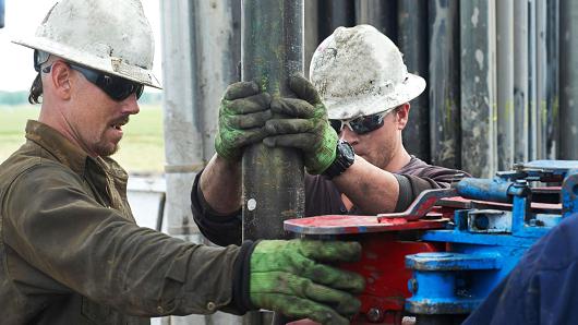 Oil workers on a rig platform in Colorado