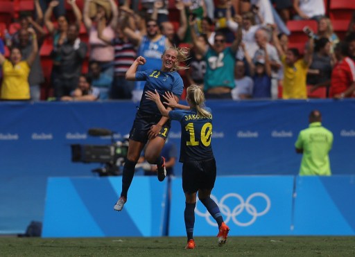 SStina Blackstenius celebrates with her teammate after scoring the opening goal of the game