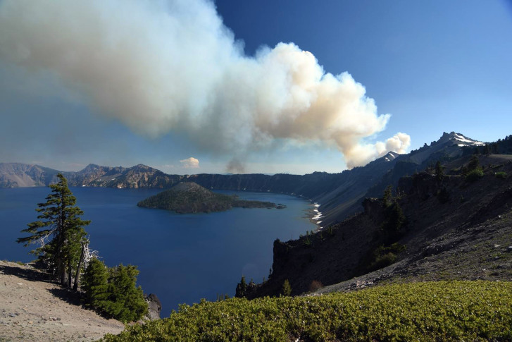 The Latest: Idaho fire grows, burns state-operated structure