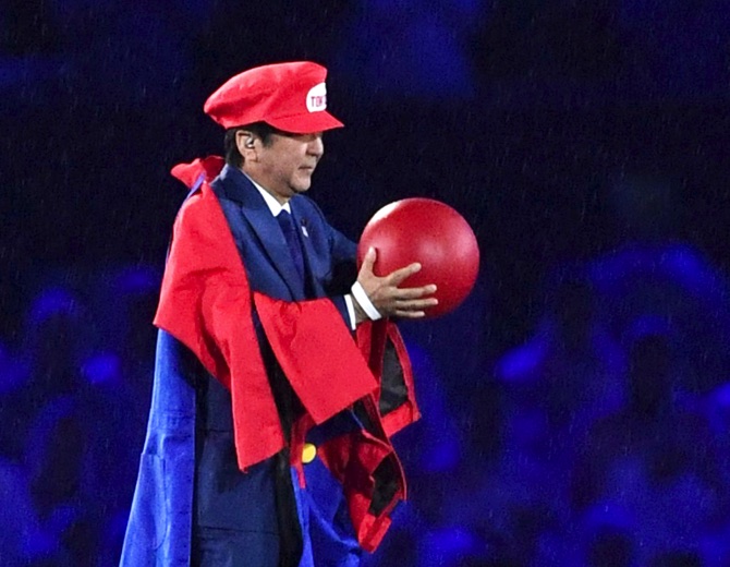 Japanese Prime Minister Shinzo Abe appears as the Nintendo game character Super Mario during the closing ceremony at the 2016 Summer Olympics in Rio de Janeiro Brazil Sunday Aug. 21 2016. Abe's brief but show-stopping appearance as Super Mario offered