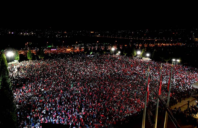 Supporters of Turkey's President Tayyip Erdogan gather in front of the Presidential Palace in Ankara