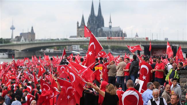 Supporters of Turkish President Recep Tayyip Erdogan attend a demonstration in Cologne Germany