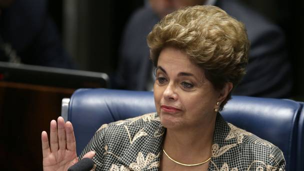 Suspended Brazilian president Dilma Rousseff waves goodbye after her impeachment trial at the Senate in Brasilia