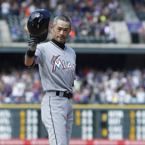 Ichiro Suzuki tips his batting helmet to the crowd to acknowledge applause after he tripled off Colorado Rockies relief pitcher Chris Rusin in the seventh inning of a baseball game Sunday Aug. 7 2016 in Denver. The hit was