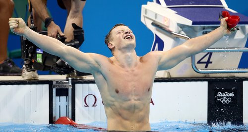 Adam Peaty celebrating his 100m breast stroke win