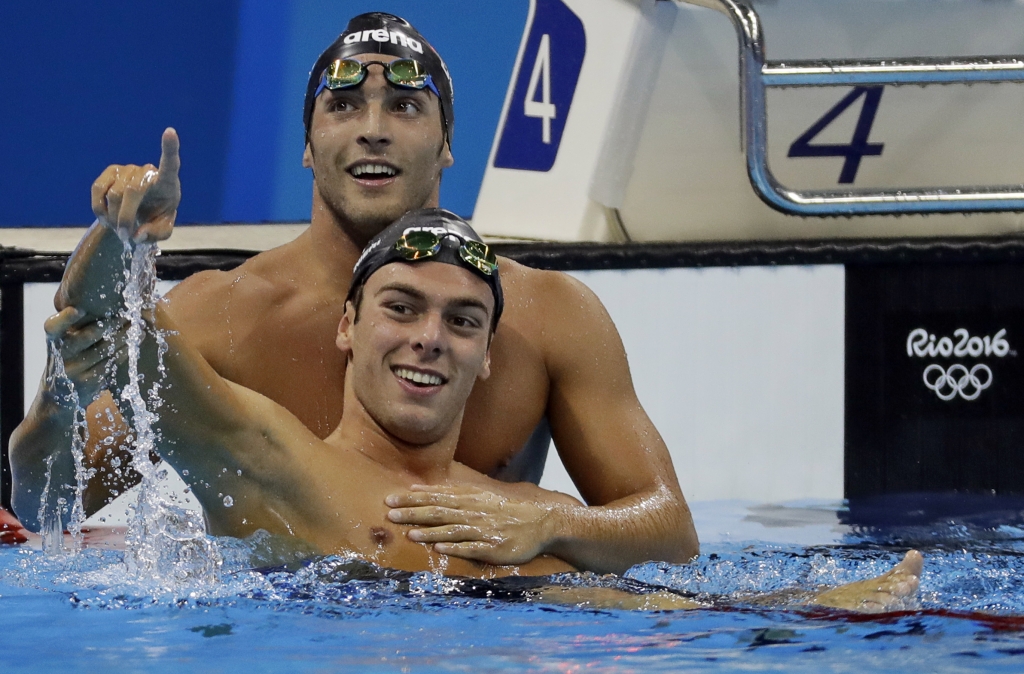 Italy's Gregorio Paltrinieri is embraced by compatriot Italy's Gabriele Detti after winning the men's 1500-meter freestyle final during the swimming competitions at the 2016 Summer Olympics Saturday Aug. 13 2016 in Rio de Janeiro Brazi