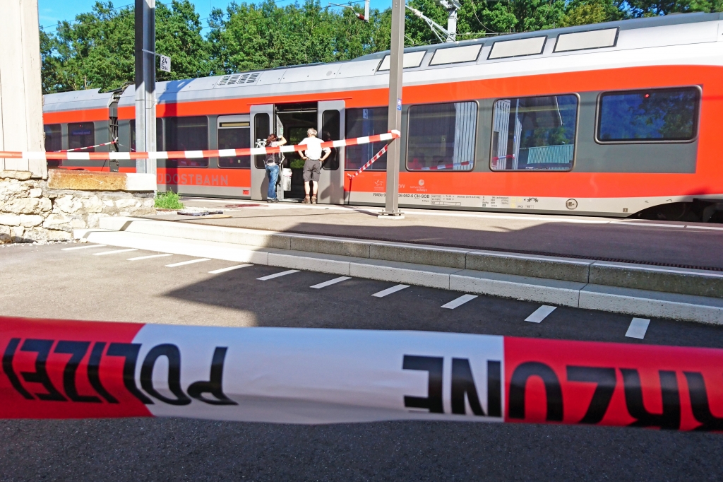 A man set a train carriage in Switzerland on fire using a flammable liquid and stabbed passengers injuring six peop