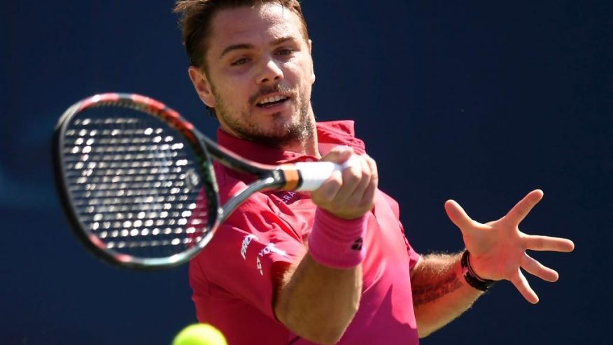 Stanislas Wawrinka of Switzerland returns the ball to Kei Nishikori of Japan during men's semifinal Rogers Cup tennis action in Toronto on Saturday