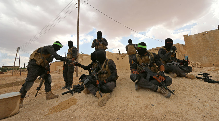 Syria Democratic Forces fighters take positions as they await U.S.-led airstrikes on ISIS strongholds. Image Credit RT